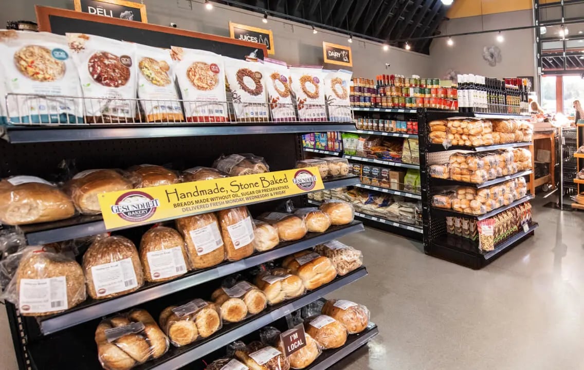 A store showcasing an array of bread and food items, designed to attract customers and boost sales effectively. A store showcasing an array of bread and food items, designed to attract customers and boost sales effectively.